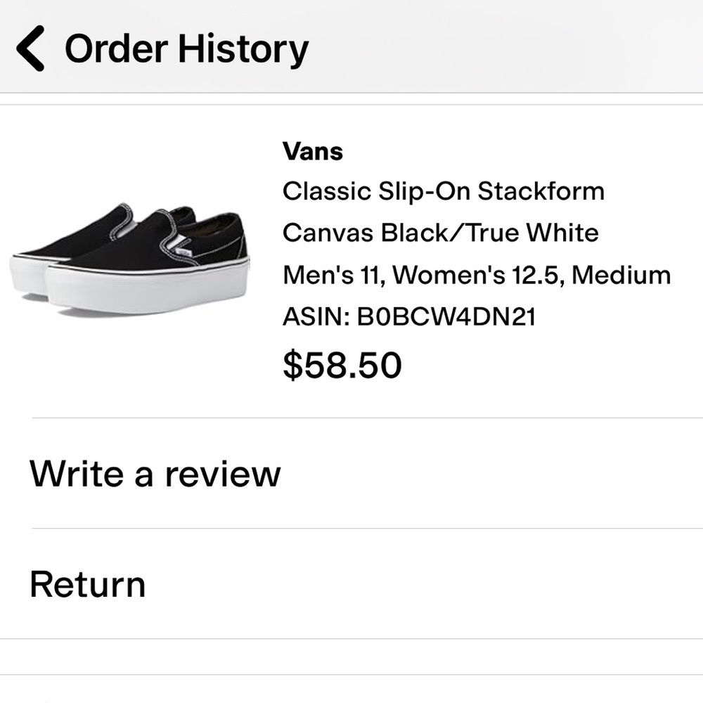 Vans Black and White Slip-On Sneakers